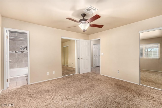 unfurnished bedroom featuring visible vents, baseboards, and carpet floors