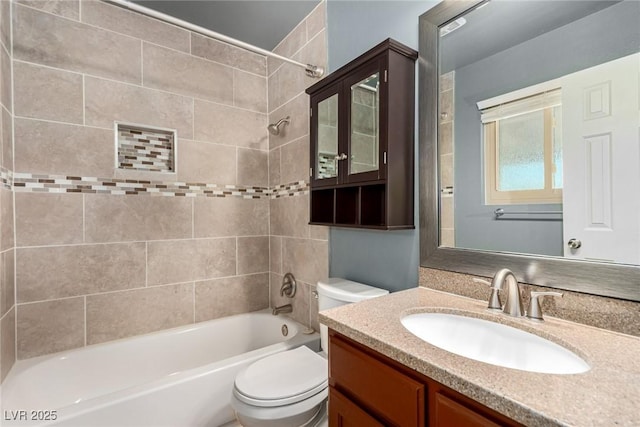 bathroom featuring vanity, toilet, and shower / bath combination