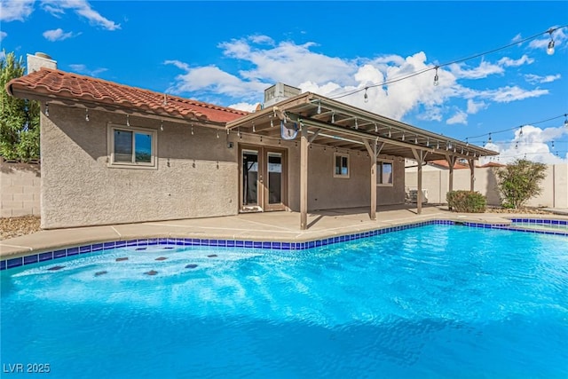 view of pool featuring a fenced in pool, french doors, a patio, and fence