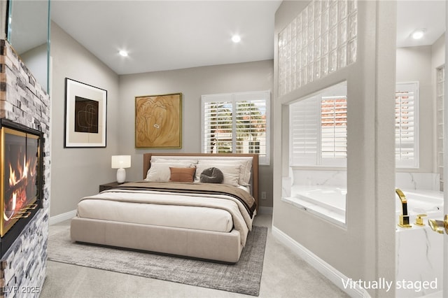 bedroom featuring recessed lighting, carpet flooring, a fireplace, and baseboards