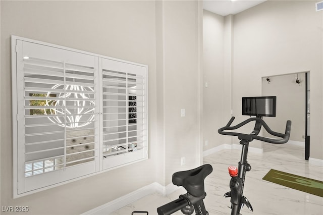 workout room with visible vents, baseboards, and marble finish floor