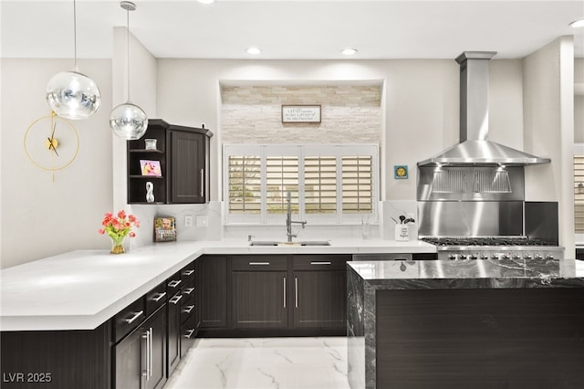 kitchen with marble finish floor, open shelves, tasteful backsplash, wall chimney exhaust hood, and hanging light fixtures