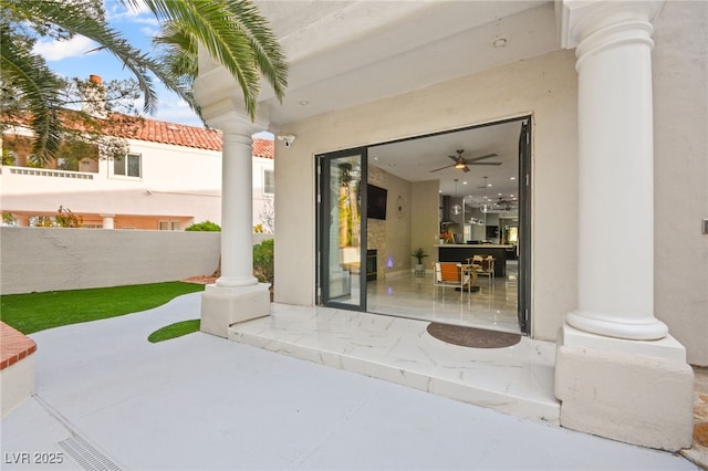 view of patio / terrace featuring fence