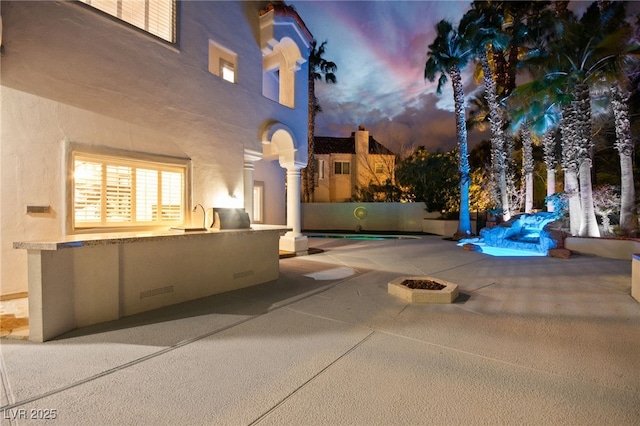 view of patio / terrace featuring area for grilling and an outdoor fire pit