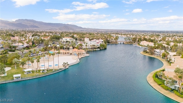 birds eye view of property with a residential view and a water and mountain view