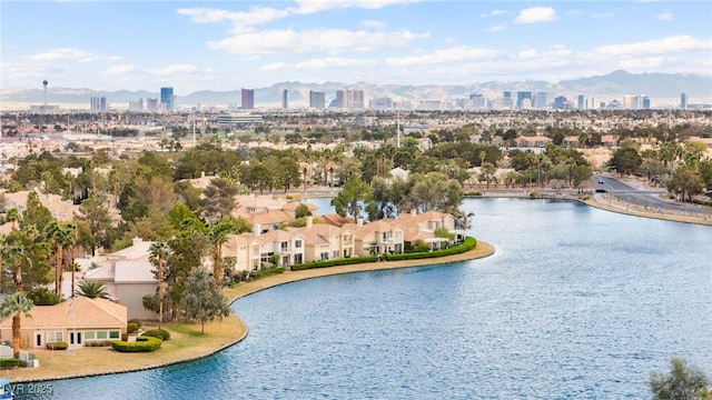 birds eye view of property with a city view and a water and mountain view