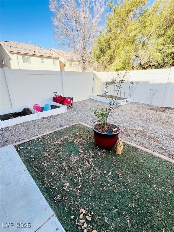 view of yard with a fenced backyard