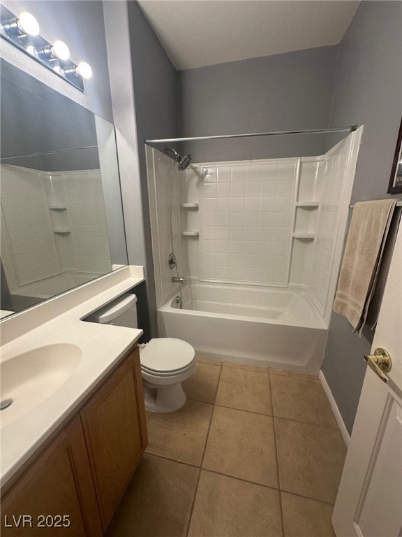 full bath with tub / shower combination, toilet, vanity, and tile patterned flooring