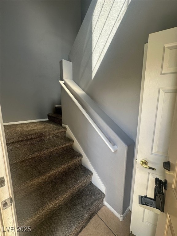 stairs featuring baseboards