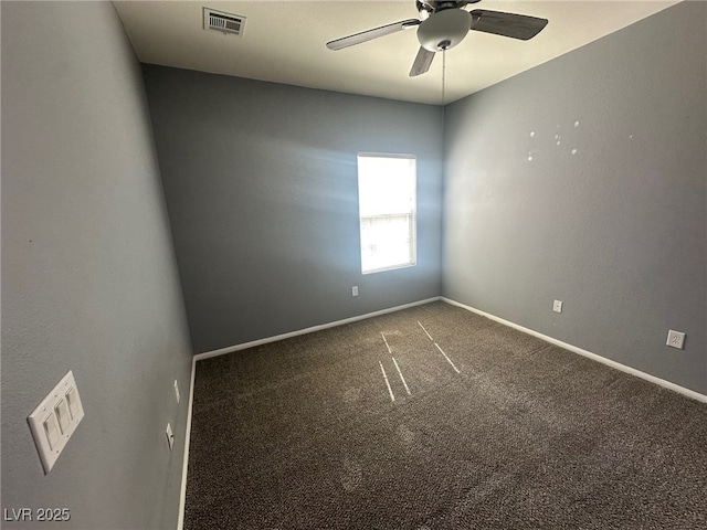 empty room featuring visible vents, baseboards, a ceiling fan, and carpet floors