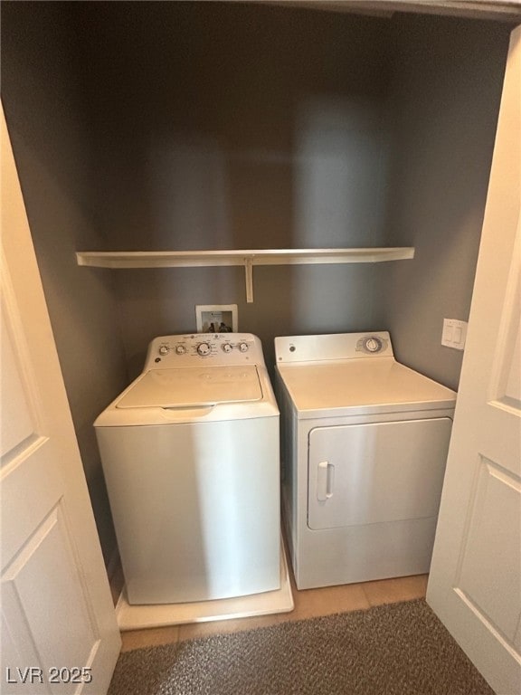 laundry area with laundry area and washer and clothes dryer