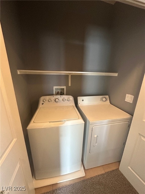 laundry room with laundry area and washing machine and clothes dryer