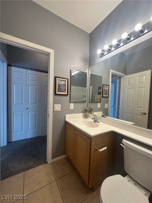 bathroom with tile patterned floors, toilet, and vanity