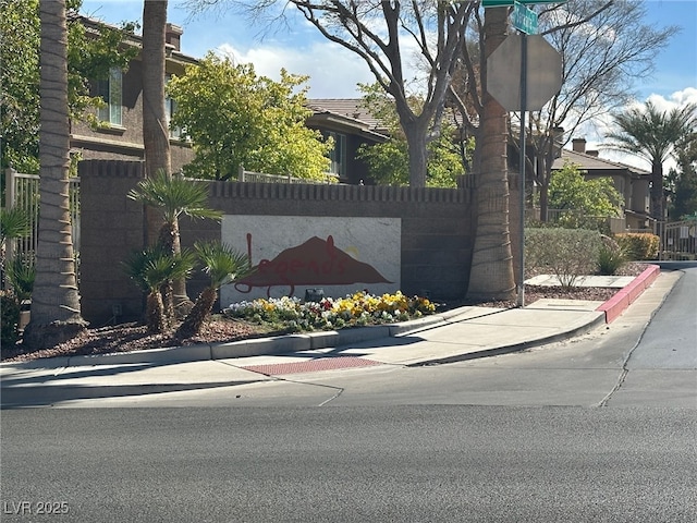 view of gate featuring fence