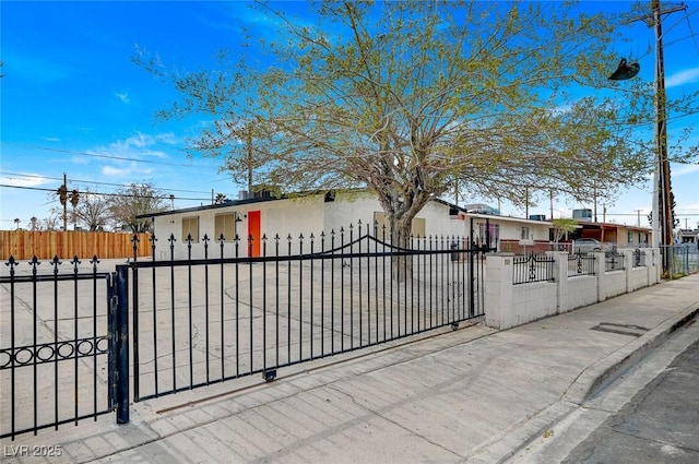 view of gate featuring a fenced front yard