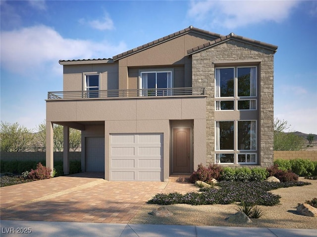 view of front facade with a balcony, stucco siding, a garage, stone siding, and decorative driveway