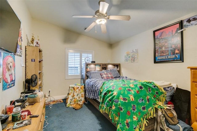 bedroom with vaulted ceiling, baseboards, and ceiling fan