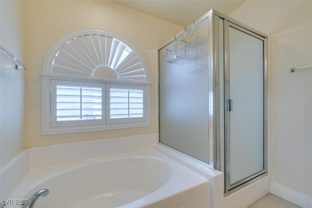 full bath with a garden tub and a stall shower