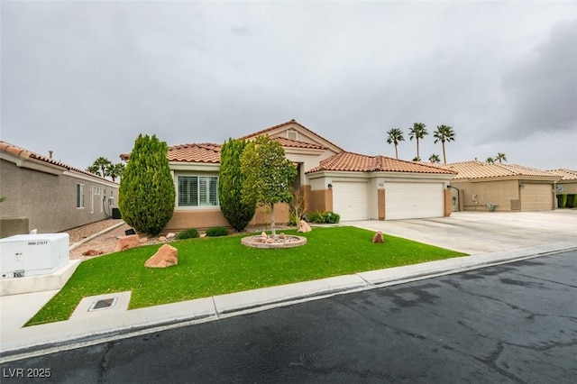 mediterranean / spanish-style home featuring concrete driveway, a tile roof, a front yard, stucco siding, and a garage