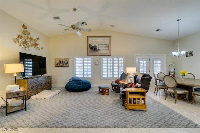 living room featuring visible vents, baseboards, and ceiling fan with notable chandelier