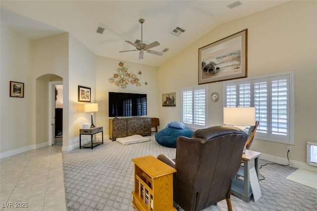 living room featuring visible vents, arched walkways, high vaulted ceiling, and ceiling fan