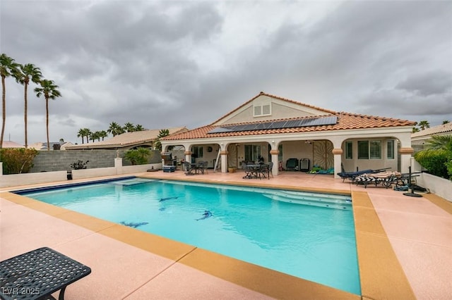 view of pool with a fenced in pool, a fenced backyard, and a patio area