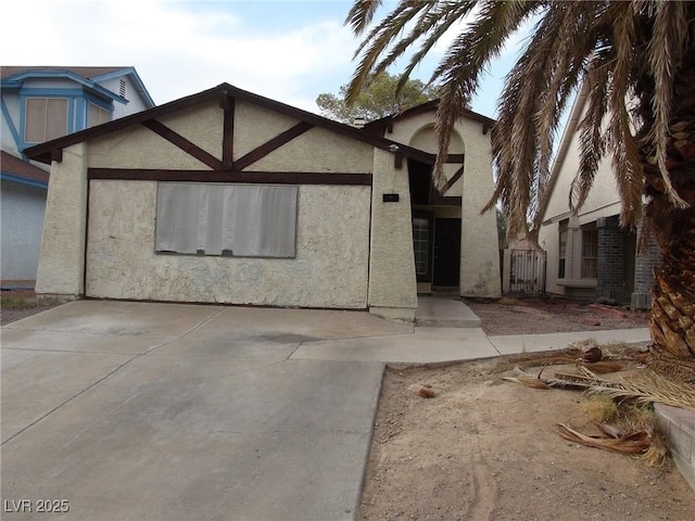 tudor-style house with stucco siding