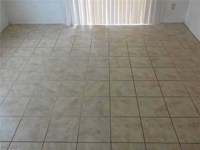 spare room with light tile patterned floors