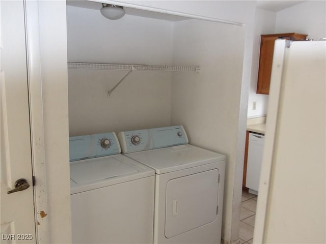 clothes washing area featuring laundry area and washer and dryer