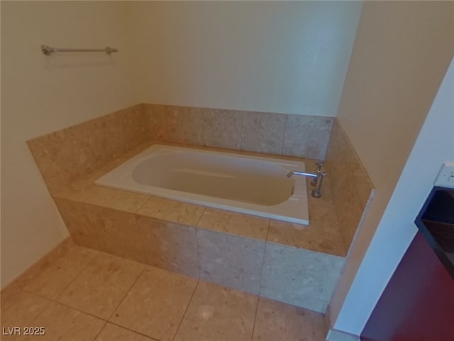 bathroom featuring tile patterned flooring and a garden tub