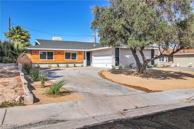 view of front of property featuring a garage and driveway