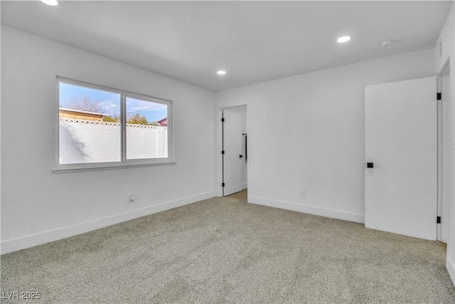 unfurnished room featuring carpet flooring, recessed lighting, and baseboards