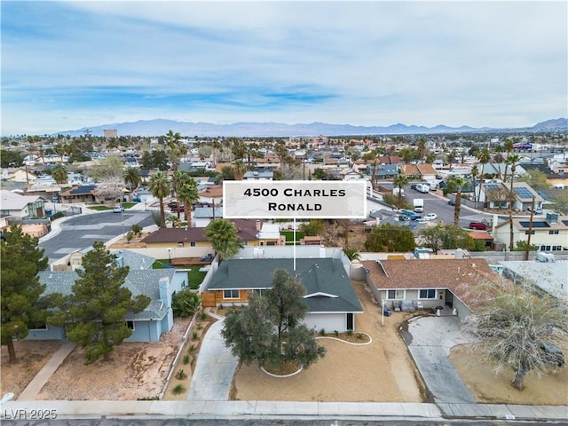 aerial view featuring a mountain view and a residential view