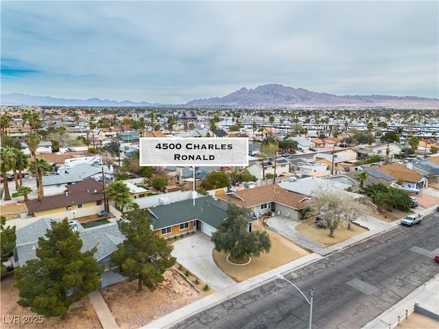 drone / aerial view with a mountain view and a residential view