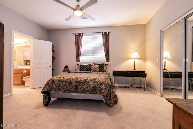 bedroom featuring visible vents, light carpet, baseboards, and connected bathroom