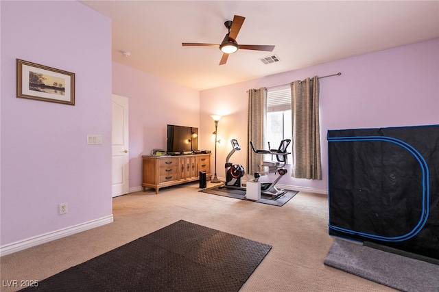 workout area featuring carpet flooring, baseboards, visible vents, and ceiling fan