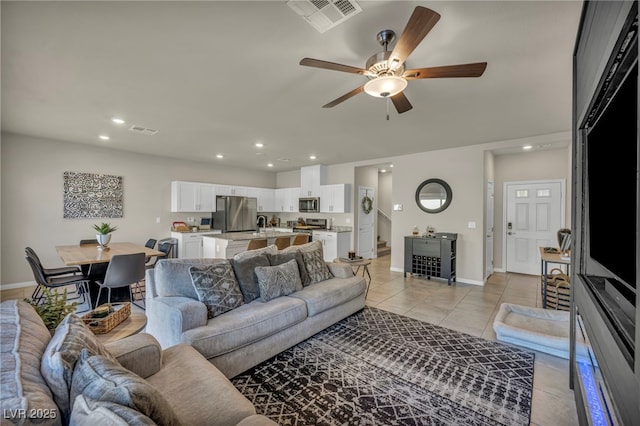 living room featuring light tile patterned floors, visible vents, recessed lighting, and ceiling fan