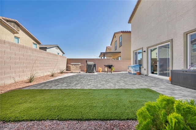 view of yard featuring central AC unit, a patio, and a fenced backyard