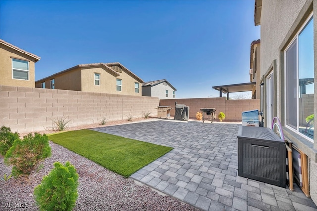 view of yard featuring a fenced backyard and a patio area