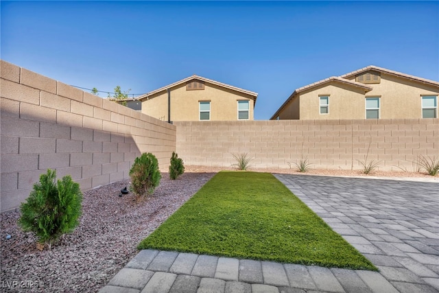 view of yard with a fenced backyard