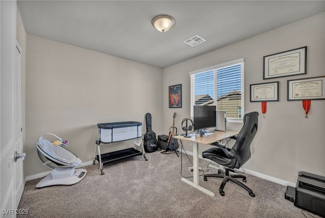 home office with visible vents, carpet floors, and baseboards