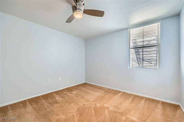 empty room with light carpet and ceiling fan