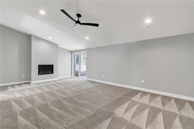 unfurnished living room featuring baseboards, carpet, recessed lighting, a fireplace, and a ceiling fan