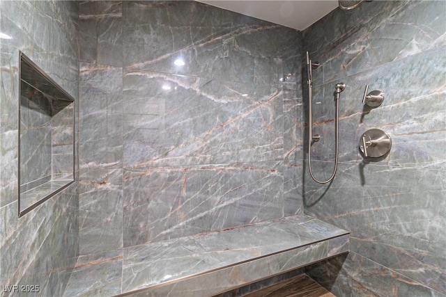 bathroom featuring tiled shower