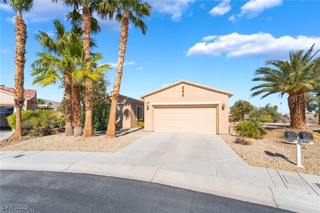 mediterranean / spanish-style house featuring stucco siding, driveway, and a garage