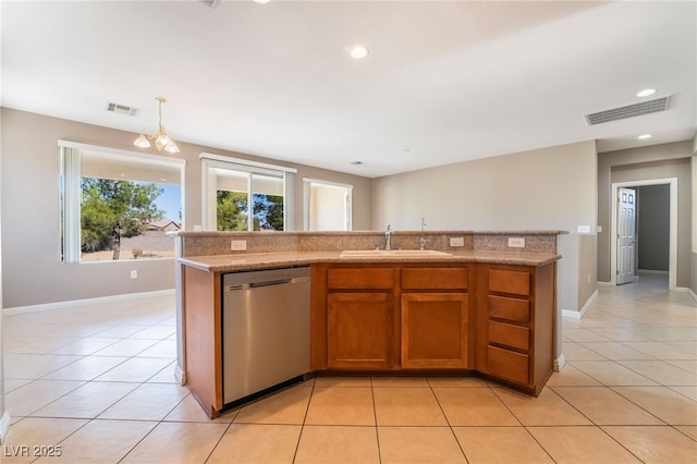 kitchen with a sink, visible vents, dishwasher, and light tile patterned floors