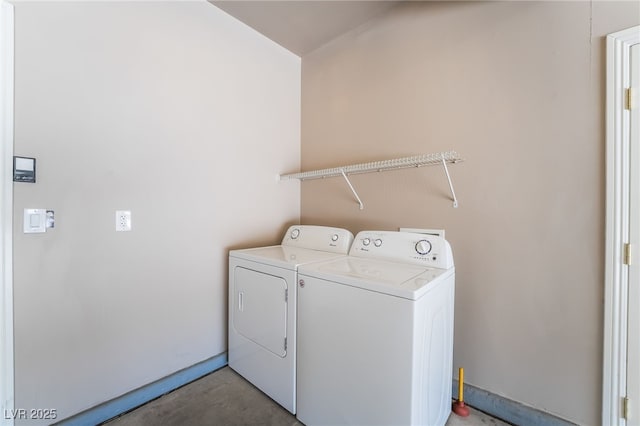 washroom with washer and clothes dryer and laundry area