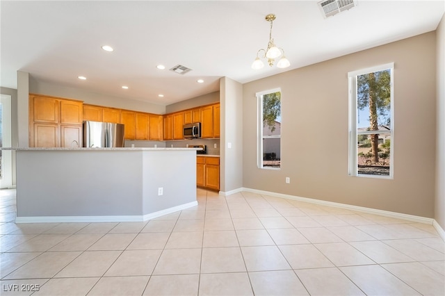 kitchen featuring recessed lighting, visible vents, appliances with stainless steel finishes, and an inviting chandelier