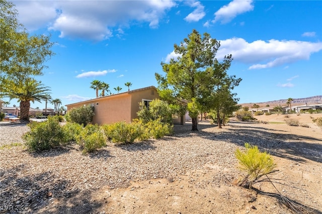 view of property exterior with stucco siding