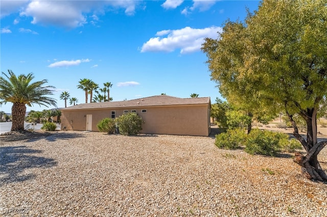 back of property with stucco siding